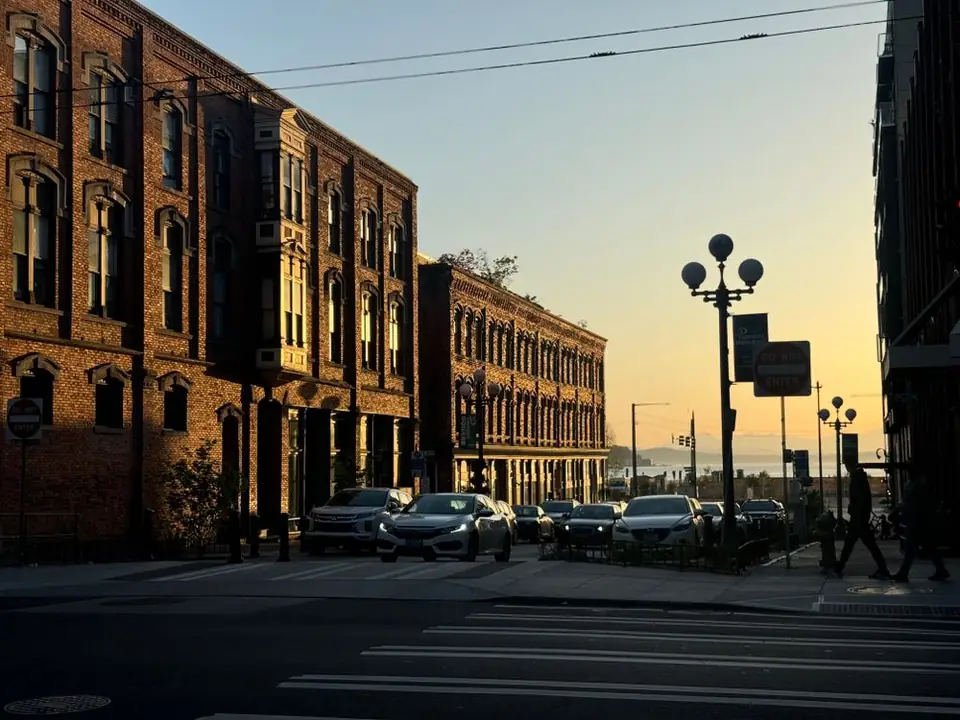 Brick buildings on a street at sunset